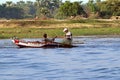 Two fishermen are in a small boat on the Nile river, Egypt