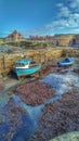 Two fishing boats on the dried seashore