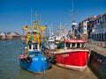 Two fishing boats moored at Maryport on the Solway Coast in Cumbria, UK.