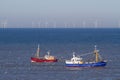 Two fishing boats with seagulls on the north sea Royalty Free Stock Photo