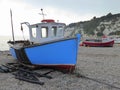 Two fishing boats on shingle beach