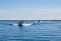 Two Fishing Boats Speeding Toward Camera