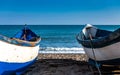 Two fishing boats resting on the beach Royalty Free Stock Photo