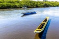 Two fishing canoes and a boat standing on the River