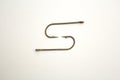 Two fishing hooks on a white paper background Royalty Free Stock Photo