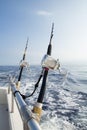 Two fishing rigs tethered to rail Royalty Free Stock Photo