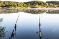 Two fishing rods on the background of the lake in the early morning, fishing Royalty Free Stock Photo