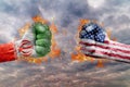Two fist with the flag of Iran and USA faced at each other