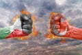 Two fist with the flag of Palestine and Turkey faced at each other