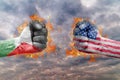 Two fist with the flag of Palestine and USA faced at each other