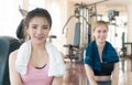 Two Fitness friends sitting in gym Royalty Free Stock Photo