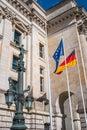 Two flags, German and European Union standing at the backyard of Reichstag building, German Parliament, and top statue of Victory