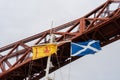 Two flags of Scotland - The Saltire and the Royal Banner of Scotland on a boat at Forth Rail Bridge