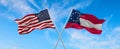 two flags of USA and state of the Confederate States of America July 1861 - November 1861 waving in the wind on flagpoles against