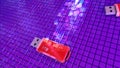 Two flash drives and abstract stream of info