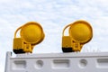 Two flashlight yellow lamp located on a white plastic panel Royalty Free Stock Photo