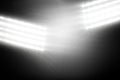 Two floodlight panels are shining in flat design on dark gradient backdrop, with starburst effect Royalty Free Stock Photo