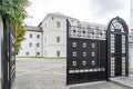 Two floors semi detached white country houses with front garden and white fence