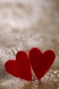 Two fluffy hearts on cracked painted background