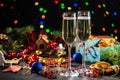 Two flutes with champagne or sparkling wine over holiday or Christmas background. Royalty Free Stock Photo