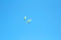 Two paragliders in blue sky Royalty Free Stock Photo