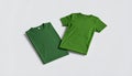 Two Folded Green T-Shirts on White Background Royalty Free Stock Photo