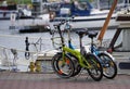 Two folding bicycles parked on the jetty for yacht by the sea Royalty Free Stock Photo