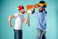 The two football fans with mouthpiece over blue Royalty Free Stock Photo