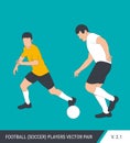 Two football opponents from different teams are fighting for the ball. Soccer players, the defender and attacker fight for the