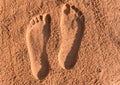 Two footprints on the sand Royalty Free Stock Photo