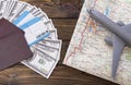 Two foreign passports with enclosed dollar bills with a tourist card and an airplane Royalty Free Stock Photo