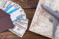 Two foreign passports with enclosed dollar bills with a tourist card and an airplane Royalty Free Stock Photo