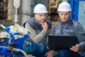 two foreman working with laptop in factory Royalty Free Stock Photo
