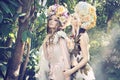 Two forest nymphs weraing fancy hats Royalty Free Stock Photo