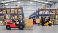 Two forklifts operating inside a large warehouse Royalty Free Stock Photo