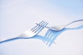 Two forks joined together symbolising togetherness, dependance and unity. This is a symbol of teamwork, relationship and Royalty Free Stock Photo