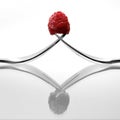 Two forks with raspberry Royalty Free Stock Photo