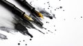 Two fountain pens with ornate nibs lie amidst black ink splatters on a white background