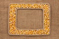 Two frame made of rope with corn grains on sackcloth Royalty Free Stock Photo