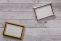 Two frames for photos on a light, vintage wooden background Royalty Free Stock Photo