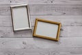 Two frames for photos on a light, vintage wooden background Royalty Free Stock Photo