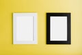 Two frames White and black photo frame on yellow background with free space. Royalty Free Stock Photo