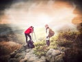 Two freelance photographers working during mountain trail Royalty Free Stock Photo