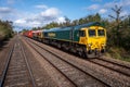 Two Freightliner Intermodal Class 66 locomotives hauling an Intermodal train with container boxes Royalty Free Stock Photo