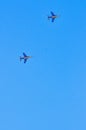 Two french training jet fighters, practicing attack formation