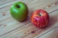 Two fresh apples. Red and green apples on the wooden background