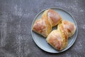 Two fresh buns with cheese covered with frosting, dessert, yeast dough Royalty Free Stock Photo