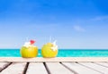 Two fresh coconut cocktails on tropical beach Royalty Free Stock Photo