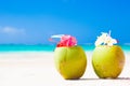 Two fresh coconut cocktails on tropical beach Royalty Free Stock Photo