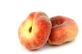 Two fresh colorful flat peaches (donut peaches) Royalty Free Stock Photo
